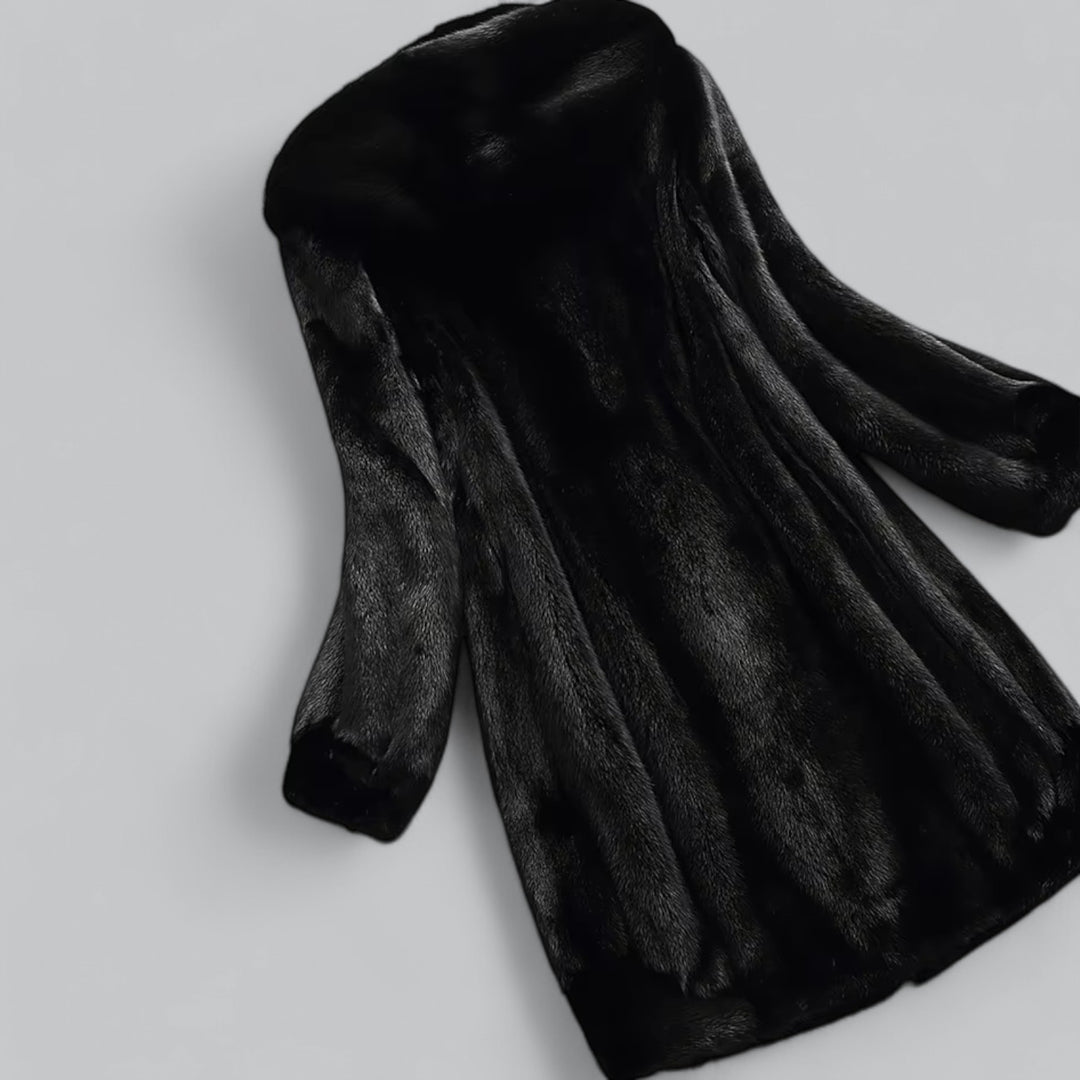 Luxe lange damesjas met een zachte faux fur afwerking.