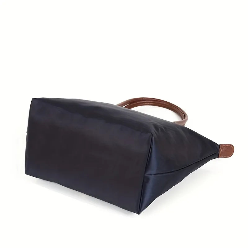 Elegante handtas met een tijdloos ontwerp en stevige handgrepen.