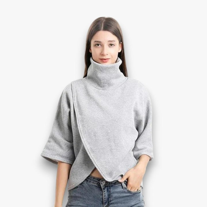 Stijlvolle damesponcho met een asymmetrische snit.
