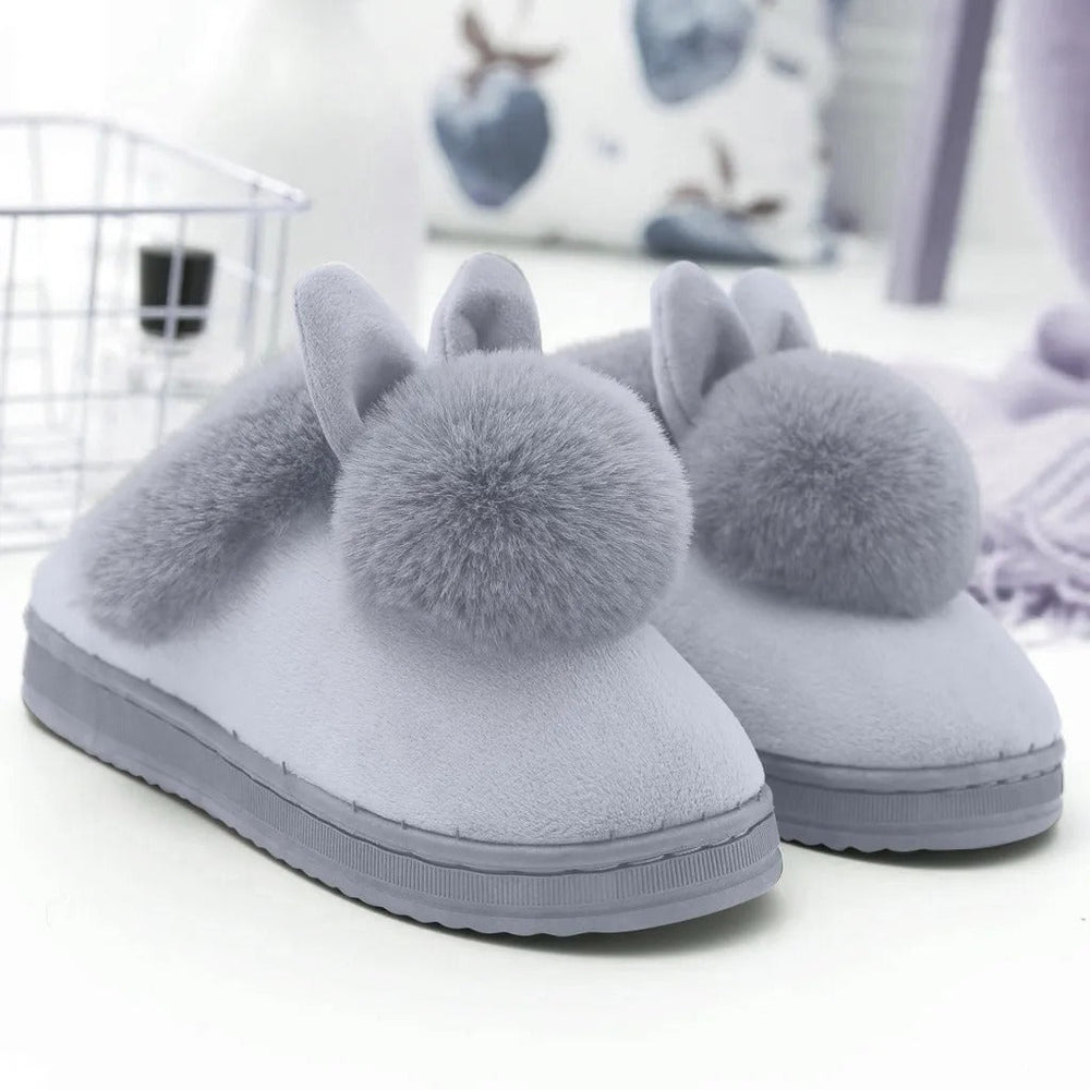 Soft women's slippers featuring adorable bunny ears.